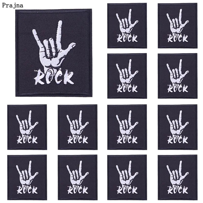 A set of ten black embroidered iron-on patches featuring a hand sign and the word ROCK.