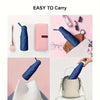 A pink compact five-fold umbrella is shown next to various cosmetic and personal items.