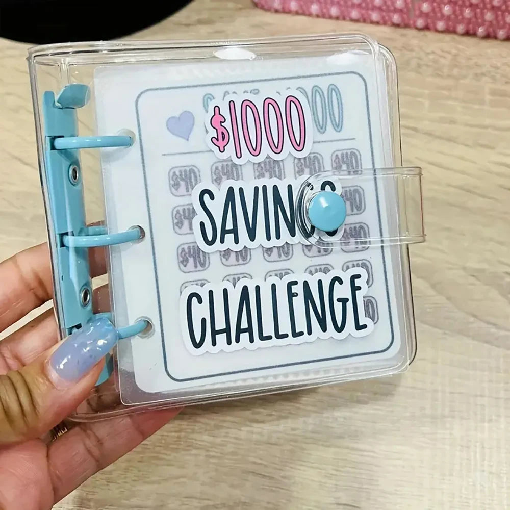 A clear plastic binder for a cash savings challenge with an envelope and a blue bead.