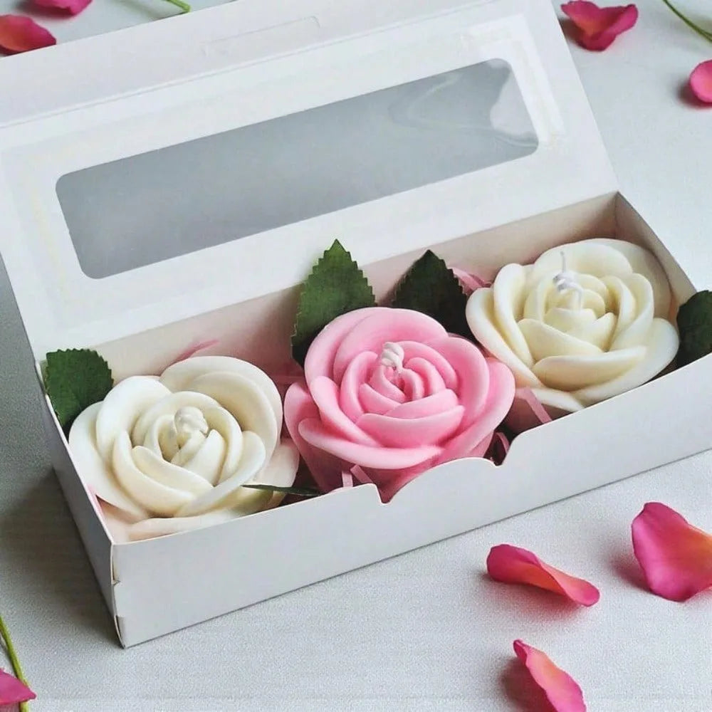 A white box contains a set of pink and cream silicone rose flower molds for crafting.