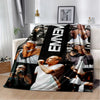 A black and white throw blanket featuring images of Eminem and 2Pac hip-hop icons.