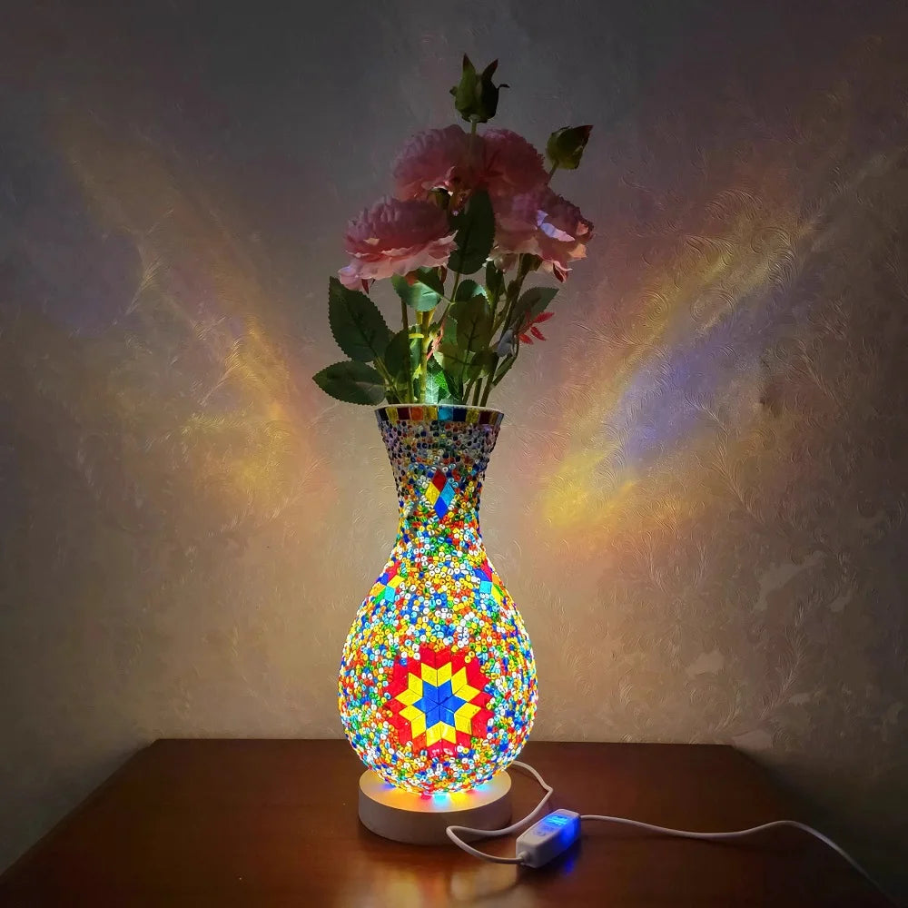 A handcrafted Turkish mosaic table lamp with a warm LED glow featuring colorful glass and floral elements.