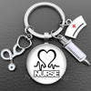 Silver keychain featuring a heart and the word NURSE design with a medical symbol and a glass dome charm.