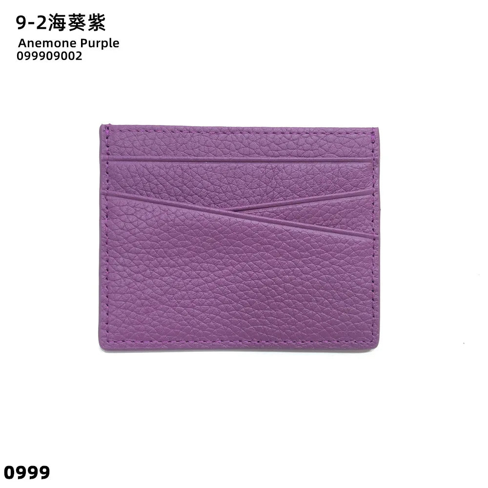 A purple genuine leather slim card holder wallet with a textured finish.