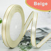 Roll of beige gold-edge satin ribbon for crafts and gift wrapping