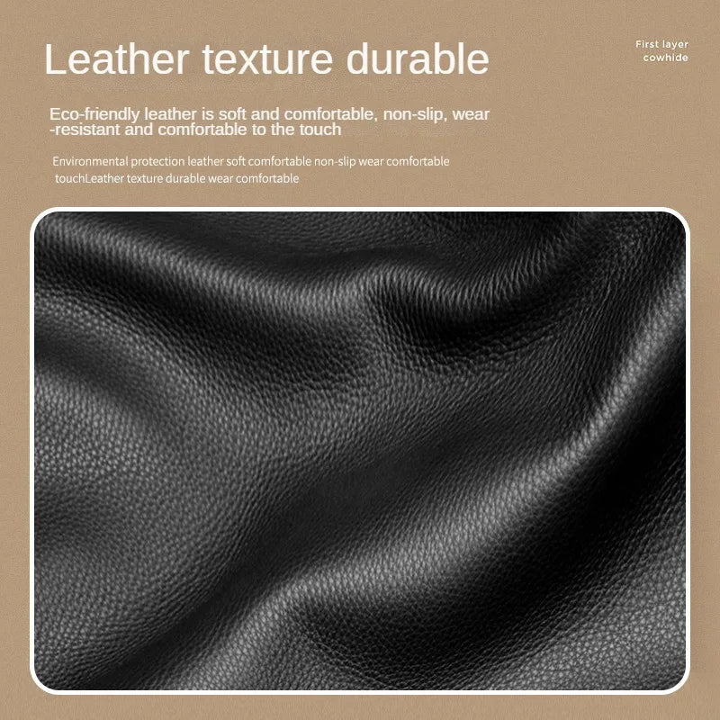 Close-up texture of black leather material showing a fine grain pattern.