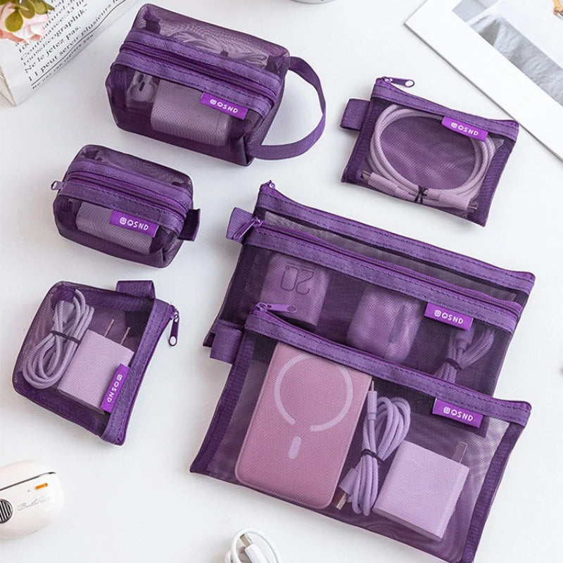 A collection of purple transparent mesh storage bags with zippers organized for coins, cards, and travel essentials.