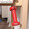 A red, cylindrical adhesive wall hook labeled 4kg is hanging from a wooden shelf.
