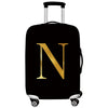 Black rolling luggage with a large gold letter N printed on the side.