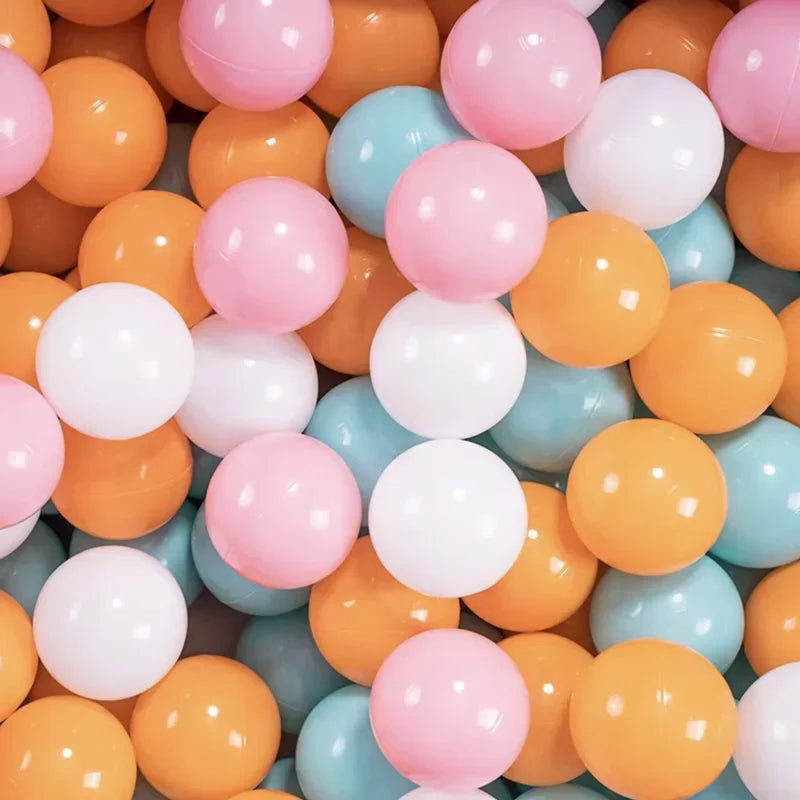 A close-up view of a large pack of colorful plastic balls in shades of pink, orange, yellow, and blue.