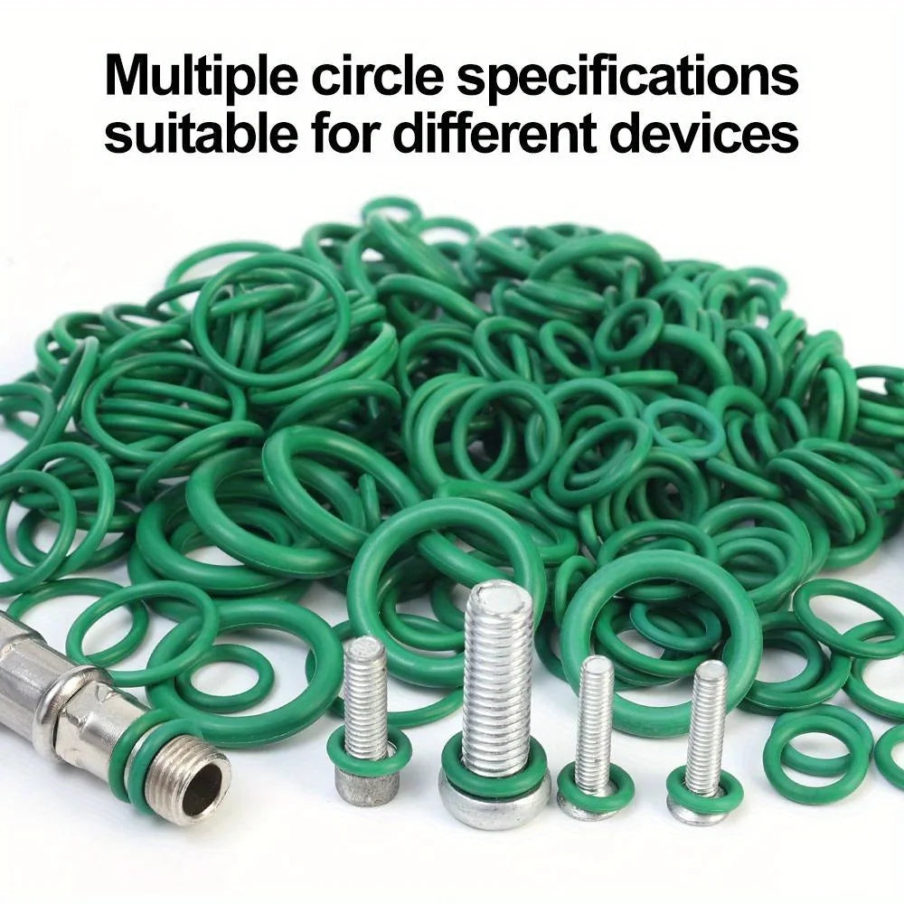 A pile of green O-ring gaskets and various metal spring components for different devices.