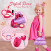 A young girl is shown holding a purple storage bag and wearing a pink dress, with various makeup and ornament accessories dis
