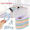 A set of ten light colored foldable travel clothes hangers with anti-slip grips are shown in various shades.