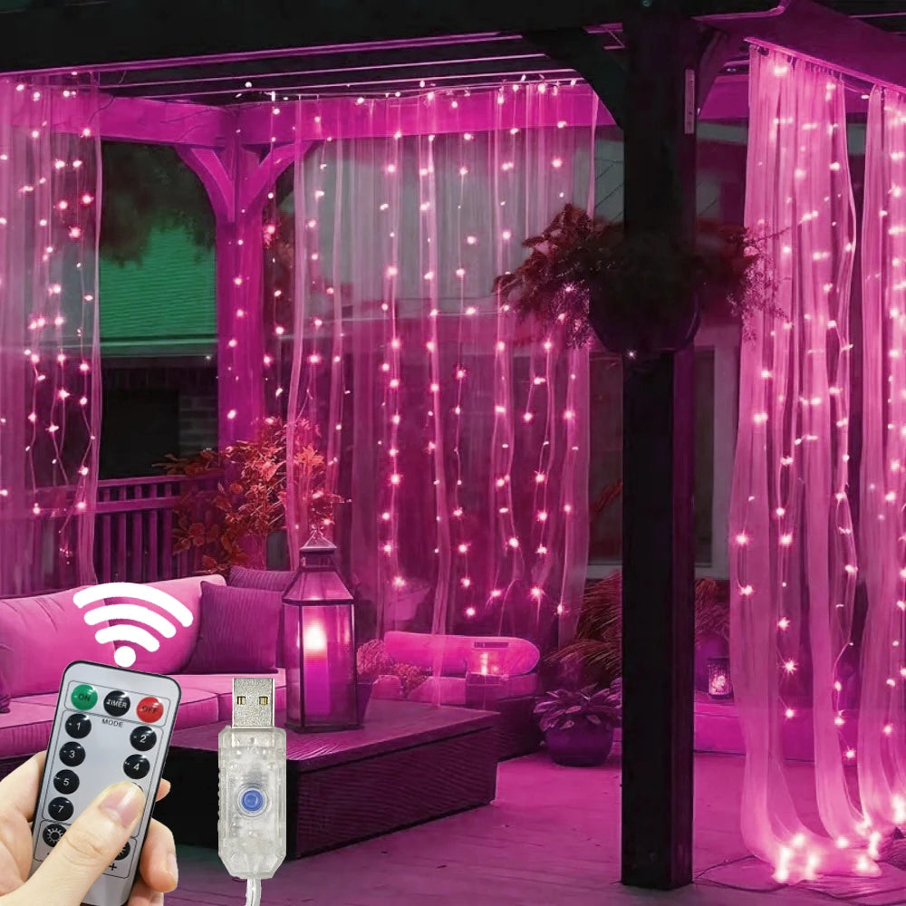 LED curtain string lights with remote control illuminating a pink indoor space.