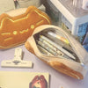 Caramel cat plush pencil case with a zipper and soft fabric lining