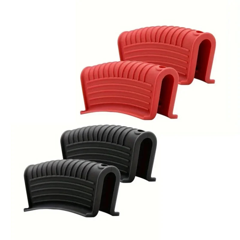 A pair of heat-resistant silicone pan handle covers in red and black.