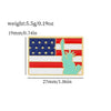 A gold-edged enamel pin featuring the United States flag design with a silhouette of the state of Tennessee.