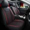 Interior view of a car showing black leather seats with red stitching and accents.