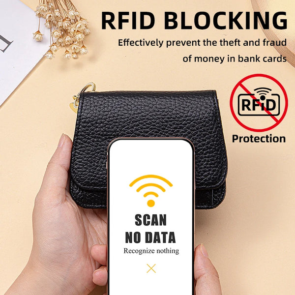 A hand holds a black leather wallet with a keychain, demonstrating RFID blocking protection against card theft.