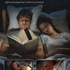 A man and a woman reading together using a 30/60-min timer book light.