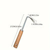 Stainless steel garden weeder with a long handle and a curved blade.