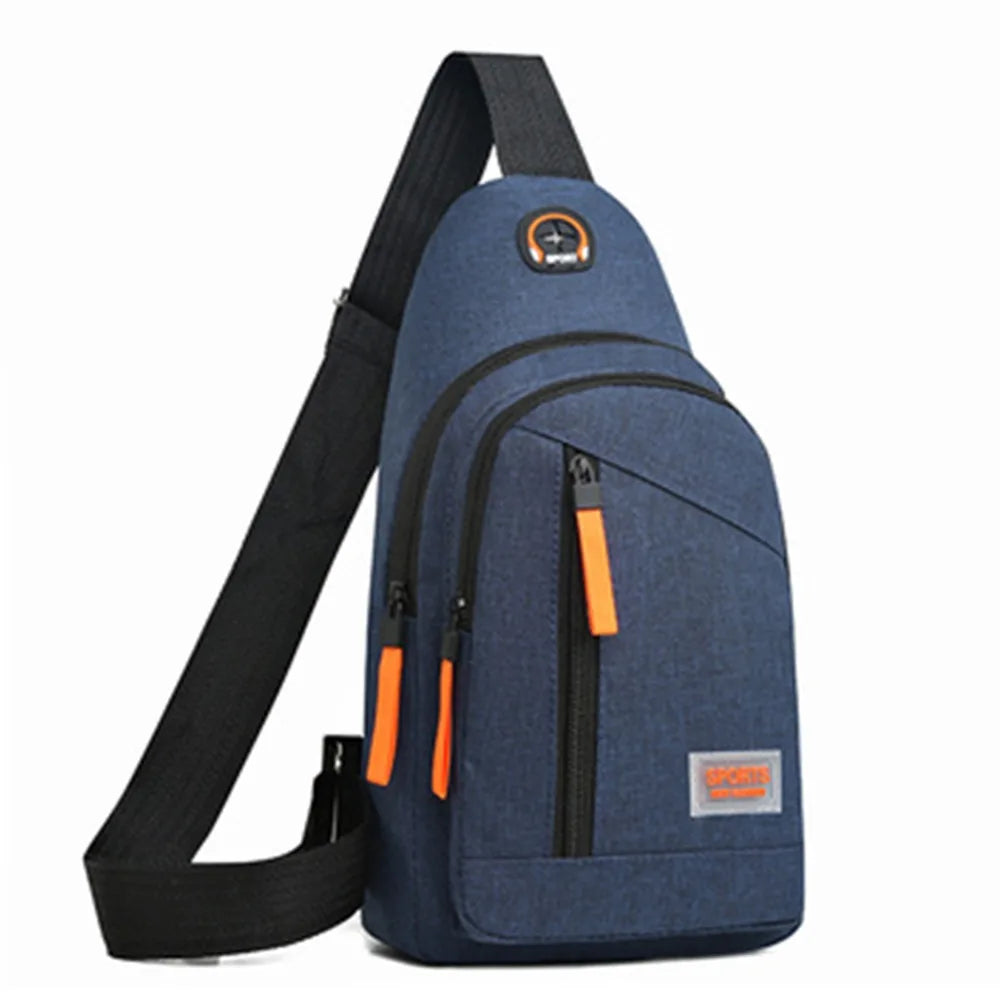 A dark blue Oxford canvas crossbody chest bag with black strap and orange accents.