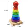 A stack of colorful wooden alphabet number and shape puzzle pieces, stacked vertically on a light wooden board.