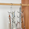 A wooden rack displaying various hanging organizers for hats, bags, and scarves.