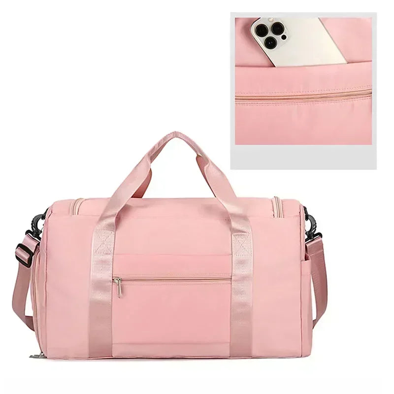 A pink large capacity travel duffel bag with a zippered compartment and a shoe section.