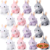 A collection of twelve soft stuffed bunny plush toys in various shades of pink and gray.