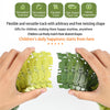 Hands hold a flexible green dinosaur adventure climbing race track toy set showing its twisting shape