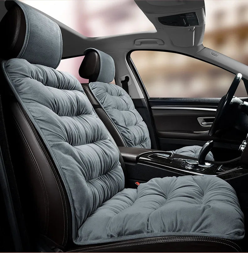 Gray plush car seat covers with backrest support installed in a vehicle interior.