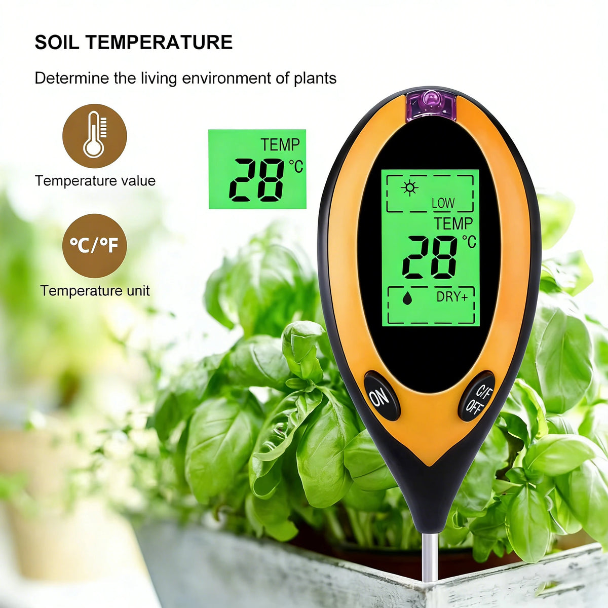An orange soil temperature meter with a digital display measuring 28 degrees Celsius, placed among green plants.