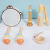 A set of wooden percussion instruments including a tambourine, maracas, and a wooden mallet.