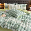 A plush, light mint green faux fur bedding set featuring a duvet and pillows against a dark upholstered headboard.