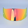 A curved, tinted visor lens shield for a motorcycle helmet, displaying an orange-to-green gradient.