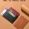 A brown leather passport holder displaying various cards and documents on a beige background.