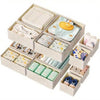 A set of foldable drawer organizer boxes for storing underwear, bras, and socks.