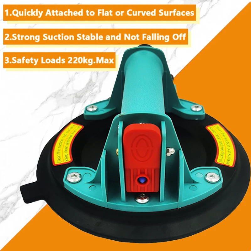 A teal vacuum suction cup lifter with a red component is shown against an orange background.