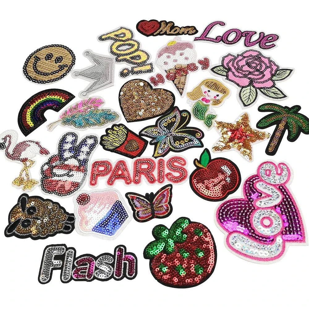 A collection of 30 assorted embroidered iron-on patches featuring various designs like hearts, flowers, and food items.