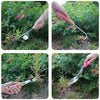 A hand is shown using a carbon steel manual weeding tool set, including a sickle, weeder, and hand shovel, in a garden settin