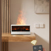 A hand holds a remote control near a modern fireplace with an open fire and LED ambiance.