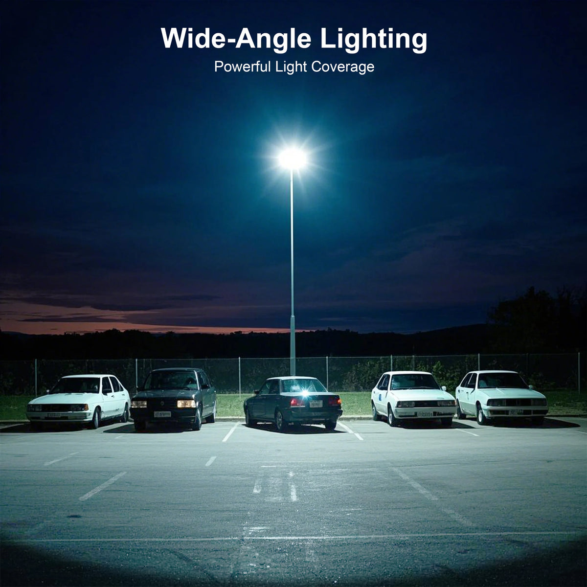 Wide-angle lighting illuminating a parking lot at night with a bright street lamp above.
