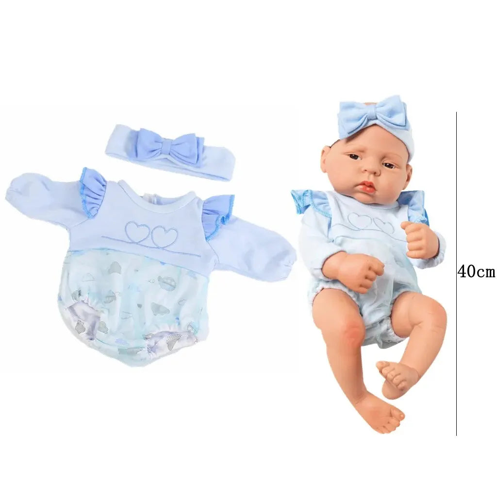 A baby doll outfit set featuring a light blue bow, top, and diaper cover for a newborn doll.