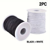 Two spools of black and white stretchy elastic cord for jewelry making