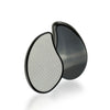 A black, teardrop-shaped hair remover with a textured silver surface is shown against a white background.