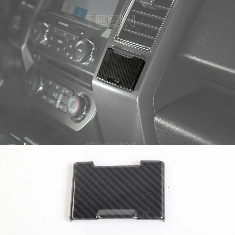 Black carbon fiber grain trim cover for a Ford F-150 center console.