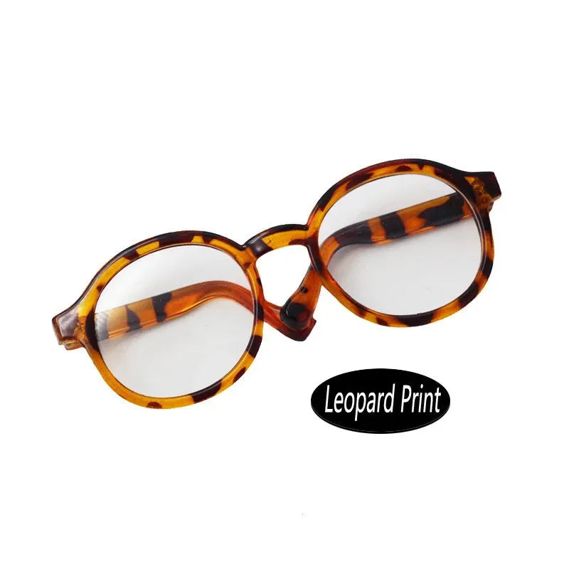 Round eyeglasses with a leopard print pattern on the frame and amber lenses.