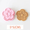 A set of three silicone cookie cutters featuring floral designs including cherry blossom, peach blossom, and sunflower shapes