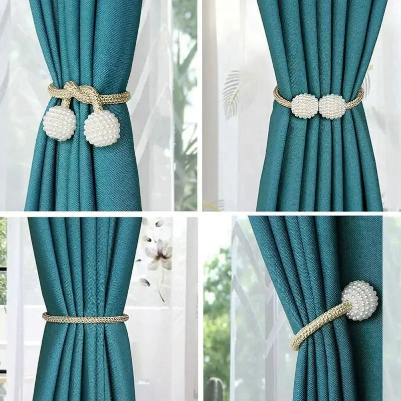 Close-up of teal fabric curtains with pearl magnetic clips in gold and white.